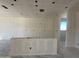This kitchen is ready for customization, including a breakfast bar and a bright, open design at 47214 W Cansados Rd, Maricopa, AZ 85139