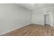 Cozy bedroom with wood-style flooring, neutral paint and attached closet at 5022 W Pierson St, Phoenix, AZ 85031