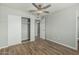 Bedroom featuring wood-style floors, neutral walls, and a modern closet at 5022 W Pierson St, Phoenix, AZ 85031