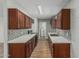 Bright kitchen with stone countertops, mosaic backsplash, and wooden cabinets at 5022 W Pierson St, Phoenix, AZ 85031