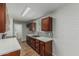 Modern kitchen with stone countertops, mosaic backsplash, and wooden cabinets at 5022 W Pierson St, Phoenix, AZ 85031
