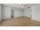 Spacious living area featuring sleek wood floors, neutral walls, and ample natural light at 5022 W Pierson St, Phoenix, AZ 85031