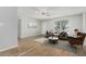Bright living room with wood flooring, gray sofa, decorative pillows, and an accent chair at 5022 W Pierson St, Phoenix, AZ 85031
