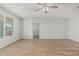 Bright living room featuring wood-style floors, neutral walls, and a modern ceiling fan at 5022 W Pierson St, Phoenix, AZ 85031