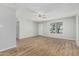 Bright and spacious living area featuring a window for natural light and sleek wood flooring at 5022 W Pierson St, Phoenix, AZ 85031