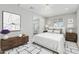 Bright bedroom featuring modern decor, a decorative rug, and an open doorway at 5022 W Pierson St, Phoenix, AZ 85031