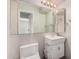 Bathroom featuring a pedestal sink, toilet, and mirror at 5738 W Heatherbrae Dr, Phoenix, AZ 85031