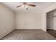 Cozy bedroom featuring ceiling fan and carpet at 5738 W Heatherbrae Dr, Phoenix, AZ 85031
