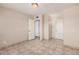 Empty bedroom showcasing tile floors and a closet at 5738 W Heatherbrae Dr, Phoenix, AZ 85031