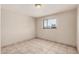 Bedroom featuring tile flooring and natural light from the window at 5738 W Heatherbrae Dr, Phoenix, AZ 85031