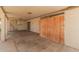 View of the carport with concrete flooring and brick siding at 5738 W Heatherbrae Dr, Phoenix, AZ 85031