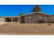 Charming single story home with a front yard and covered parking at 5738 W Heatherbrae Dr, Phoenix, AZ 85031