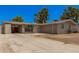 Charming single story home with a front yard, covered parking and mature trees at 5738 W Heatherbrae Dr, Phoenix, AZ 85031