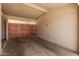 Open garage with a block wall at 5738 W Heatherbrae Dr, Phoenix, AZ 85031