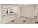 Bright kitchen with white cabinets, granite countertops, and stainless steel appliances at 5738 W Heatherbrae Dr, Phoenix, AZ 85031