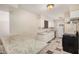 Well-lit kitchen featuring white cabinets and tiled floor at 5738 W Heatherbrae Dr, Phoenix, AZ 85031