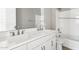 Bathroom features double sinks, large mirror, shower, and a toilet at 5840 E Covey Ln, Phoenix, AZ 85054