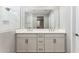 Bathroom with double sink vanity, sleek hardware, and a large mirror at 5840 E Covey Ln, Phoenix, AZ 85054