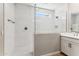 Stylish walk-in shower with marble tile, glass door, and modern fixtures at 5840 E Covey Ln, Phoenix, AZ 85054