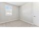 Light-filled bedroom features a window with blinds and neutral decor at 5840 E Covey Ln, Phoenix, AZ 85054