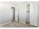 Bedroom with large closet space and plenty of natural light at 5840 E Covey Ln, Phoenix, AZ 85054