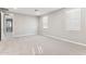 Spacious, light-filled bedroom featuring neutral walls and plush carpeting at 5840 E Covey Ln, Phoenix, AZ 85054