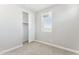 Well-lit bedroom featuring a closet and a bright window at 5840 E Covey Ln, Phoenix, AZ 85054