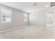 Spacious carpeted bedroom with natural light from two large windows at 5840 E Covey Ln, Phoenix, AZ 85054