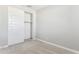 Neutral bedroom features a sliding door closet and plush carpeting at 5840 E Covey Ln, Phoenix, AZ 85054