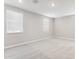 A spacious bedroom featuring neutral walls and carpet flooring, illuminated by natural light from the window at 5840 E Covey Ln, Phoenix, AZ 85054