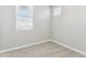 Well-lit bedroom with neutral carpet and bright windows and blinds at 5840 E Covey Ln, Phoenix, AZ 85054