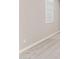 Close-up of a bedroom wall with window, blinds, and base trim at 5840 E Covey Ln, Phoenix, AZ 85054
