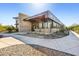 Contemporary building with stone accents, covered entry, and bike racks at 5840 E Covey Ln, Phoenix, AZ 85054