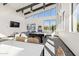 A sunlit recreation room is equipped with a billiards table and comfortable lounge area, ideal for relaxing and socializing at 5840 E Covey Ln, Phoenix, AZ 85054