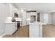 Modern kitchen featuring stainless steel appliances, a stylish subway tile backsplash, and a convenient center island at 5840 E Covey Ln, Phoenix, AZ 85054
