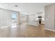 Open-concept floorplan featuring a spacious kitchen with white cabinets, a center island and sliding doors to the backyard at 5840 E Covey Ln, Phoenix, AZ 85054