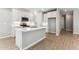 Well-designed kitchen with stainless steel appliances, a stylish subway tile backsplash, and a convenient center island at 5840 E Covey Ln, Phoenix, AZ 85054