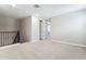 Spacious upstairs loft area with carpet flooring and neutral walls, perfect for relaxing and watching TV at 5840 E Covey Ln, Phoenix, AZ 85054