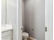 Cozy powder room featuring a modern toilet and stylish fixtures at 5840 E Covey Ln, Phoenix, AZ 85054