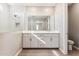 Bathroom with double vanity, tile floors, and a glass enclosed shower at 5844 E Covey Ln, Phoenix, AZ 85054
