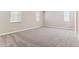 Large bedroom with neutral walls, plush carpeting, and multiple bright windows with blinds at 5844 E Covey Ln, Phoenix, AZ 85054
