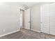 Neutral carpeted bedroom with walk in closet with sliding doors at 5844 E Covey Ln, Phoenix, AZ 85054