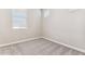 A cozy carpeted bedroom with a window for natural light at 5844 E Covey Ln, Phoenix, AZ 85054