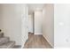 Bright hallway features wood-look tiled floor that leads to multiple doors at 5844 E Covey Ln, Phoenix, AZ 85054