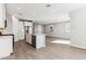 Stylish kitchen featuring white cabinetry, stainless steel appliances, and center island with a sink at 5844 E Covey Ln, Phoenix, AZ 85054