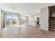 Bright open-concept living room with tile floors, recessed lighting, and sliding glass doors at 5844 E Covey Ln, Phoenix, AZ 85054