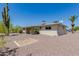 Backyard featuring desert landscaping, a covered patio, and a view of the home's exterior at 6027 E Ellis St, Mesa, AZ 85204