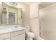 Bathroom featuring single sink vanity, mirrored cabinet and shower at 6027 E Ellis St, Mesa, AZ 85204