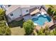 Aerial view of a private backyard pool with a covered patio and lush landscaping at 6164 E Greenway Ln, Scottsdale, AZ 85254