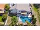 Aerial view of backyard pool with lounge chairs on a patio and well-maintained landscaping surrounding the property at 6164 E Greenway Ln, Scottsdale, AZ 85254